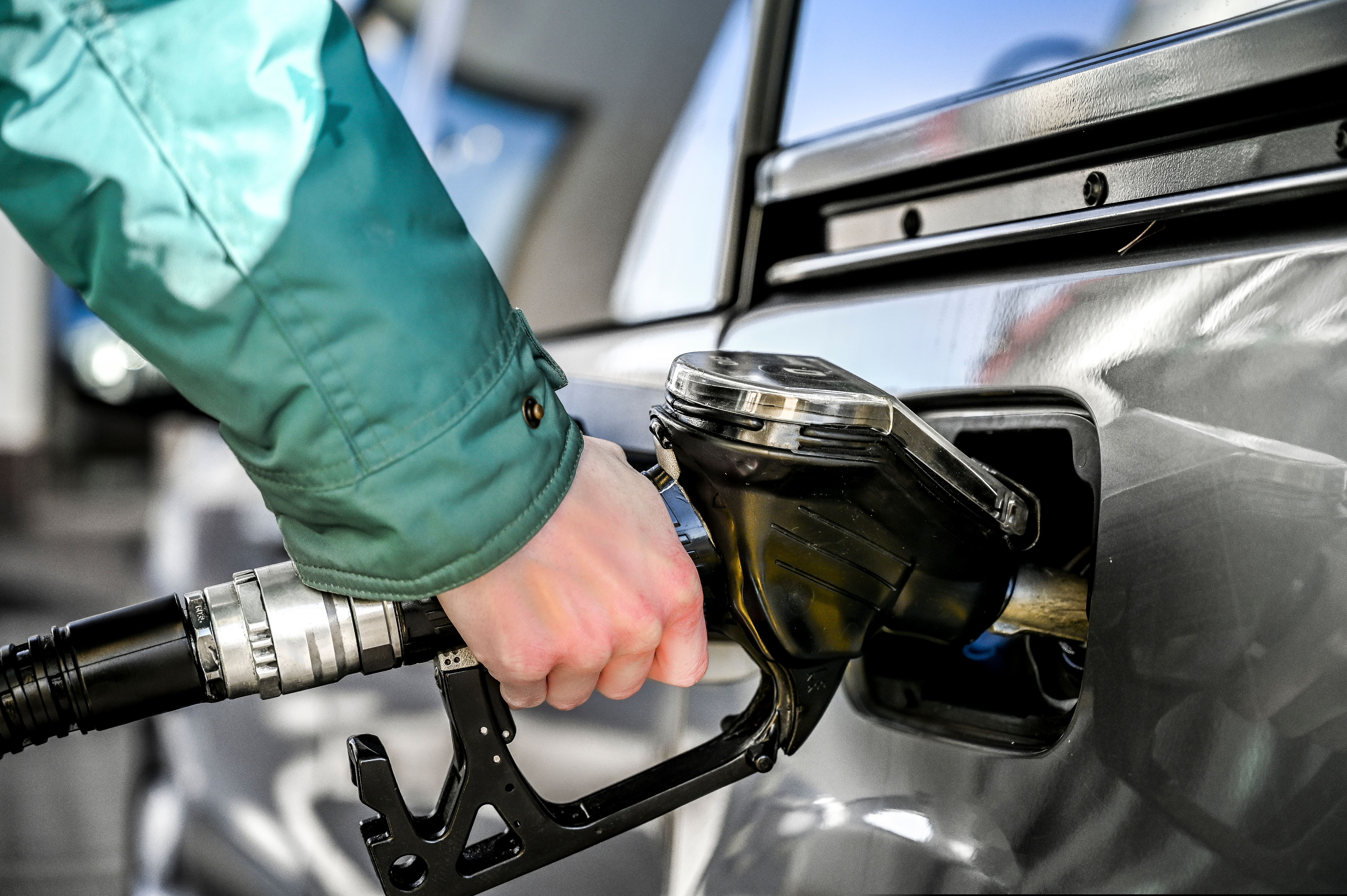 Woman,Refueling,At,A,Gas,Station.,Pumping,Gas.
