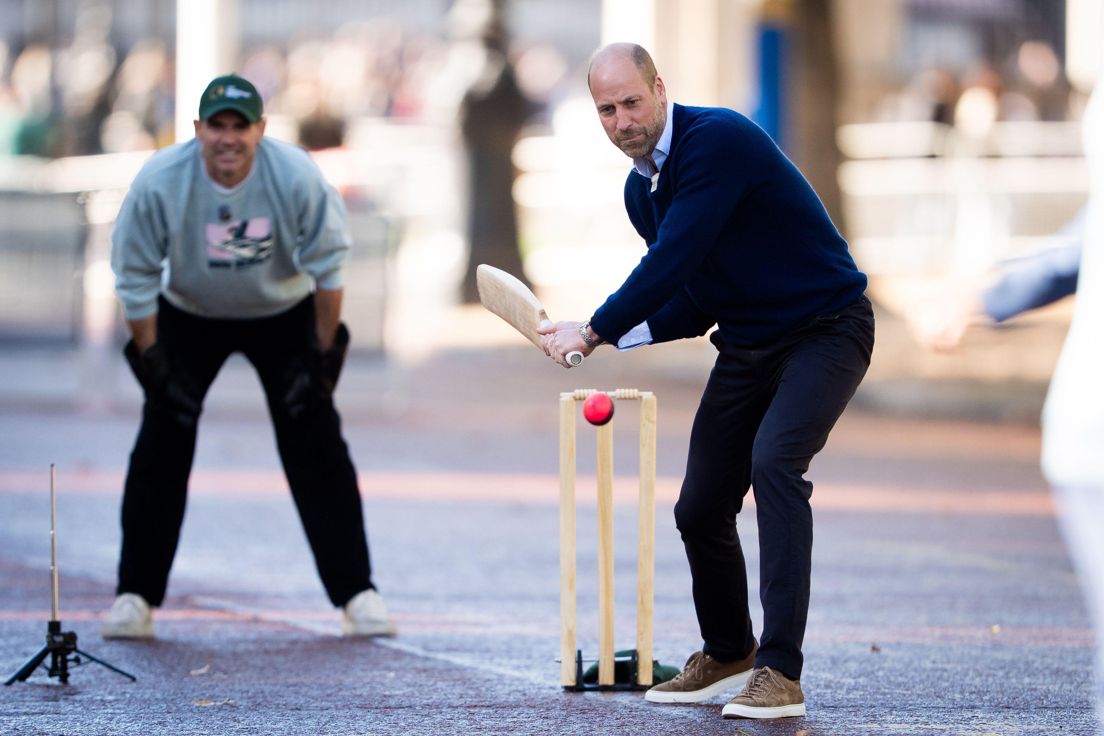 The Prince of Wales batting as he joins cricketing stars from the UK and India, the team from Tailenders and Backyard Cricket, at a special Earthshot Prize event on The Mall, in London, organised by the team at Backyard Cricket to celebrate ties between t
